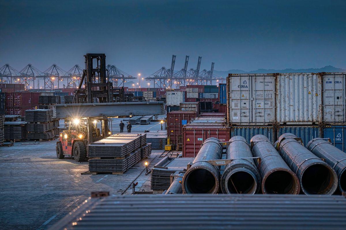 Port terminal with containers, steel plates and pipes